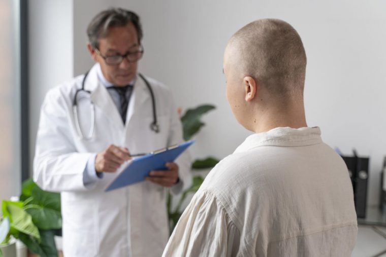 A male doctor and a bald male patient